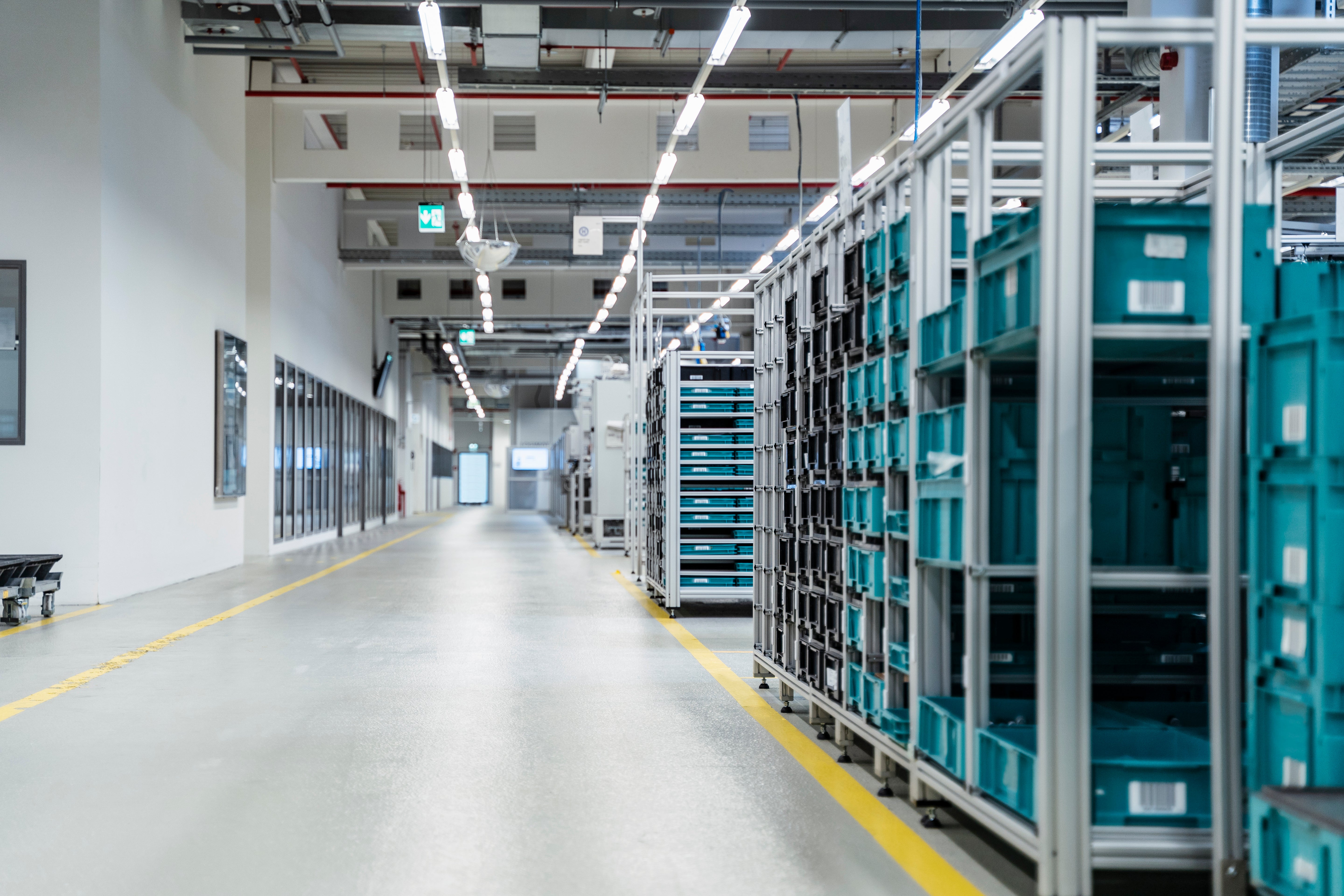stacked-containers-inside-modern-factory-warehouse-2026-03-09-05-19-53-utc.jpg